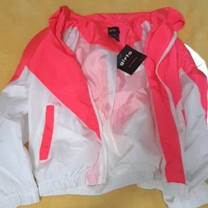This is a White and hot pink sweater size 7-14 for kids